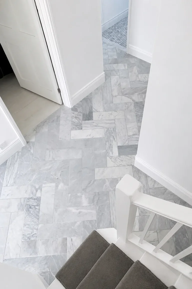 Finished Chiswick ground-floor marble herringbone tiled hallway.
