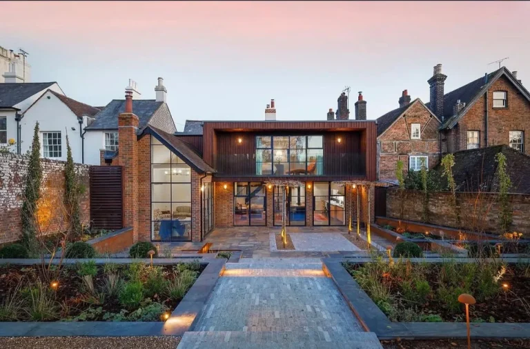 Landscaped back garden terrace with tiled exterior path